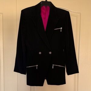 Stylish vintage jacket with zippered pockets and hot pink lining.